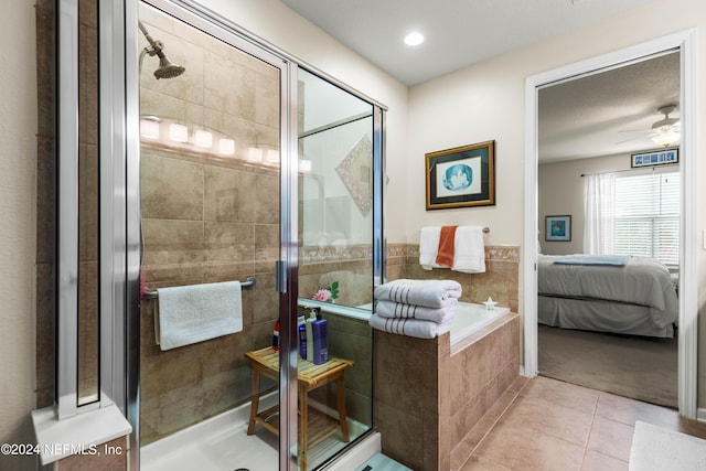 9831 Del Webb Pkwy Unit 2308, Jacksonville, FL 32256 - ensuite bathroom with tile patterned flooring, a shower stall, a bath, and ceiling fan