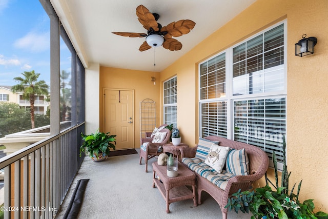 sunroom featuring ceiling fan