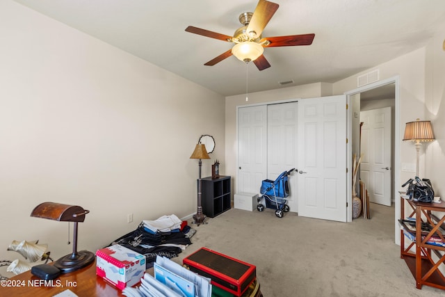 miscellaneous room with carpet flooring and ceiling fan