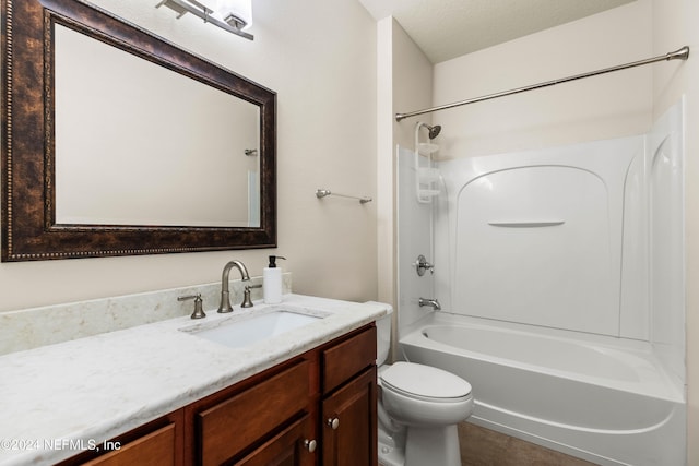 full bathroom with toilet, shower / tub combination, vanity, and a textured ceiling