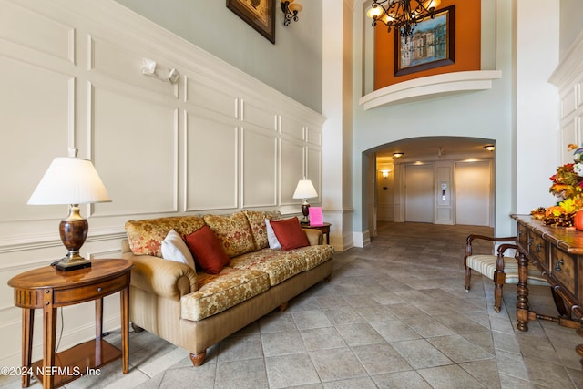 9831 Del Webb Pkwy Unit 2308, Jacksonville, FL 32256 - building lobby featuring a decorative wall and a towering ceiling