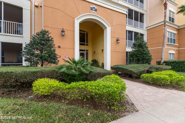 entrance to property with a balcony