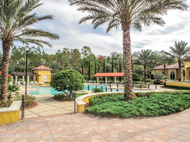 view of swimming pool featuring a patio area