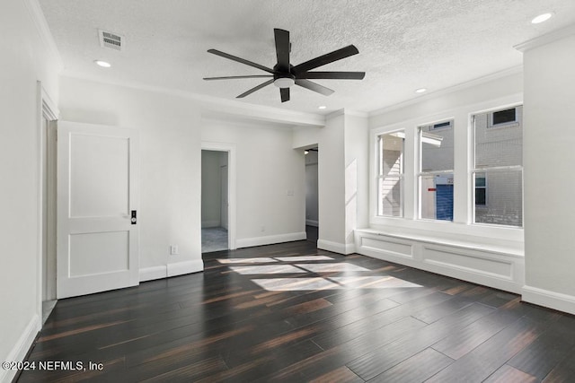 unfurnished room featuring ornamental molding, dark wood-type flooring, a textured ceiling, and ceiling fan