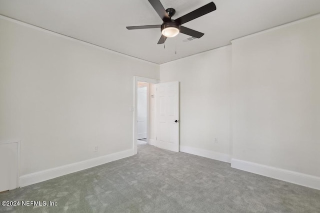 carpeted empty room featuring ceiling fan