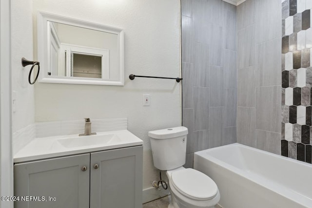 full bathroom with vanity, toilet, and tiled shower / bath