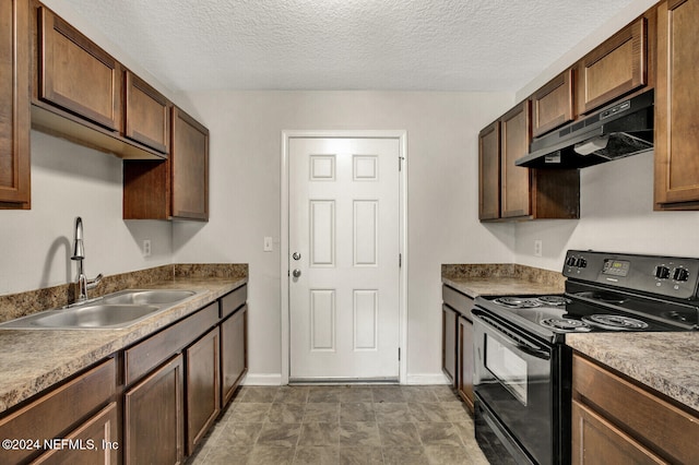 kitchen featuring black range, sink, and a textured ceiling