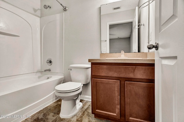 full bathroom featuring  shower combination, vanity, and toilet