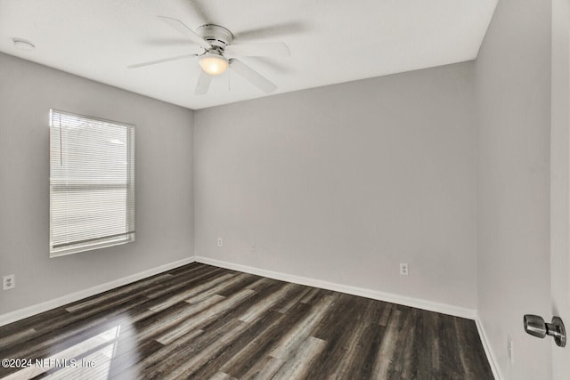 spare room with ceiling fan and dark hardwood / wood-style flooring