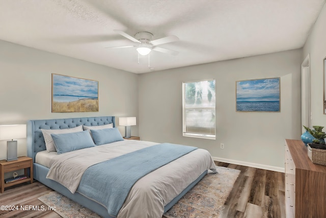 bedroom featuring dark hardwood / wood-style floors and ceiling fan