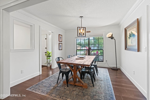 dining space with ornamental molding, a notable chandelier, a textured ceiling, and dark hardwood / wood-style floors