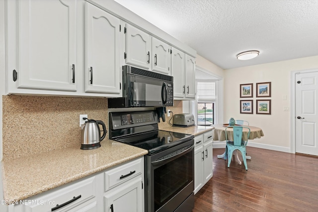 kitchen featuring dark wood-type flooring, a textured ceiling, black appliances, and white cabinetry