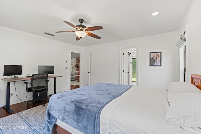 bedroom with dark wood-type flooring and ceiling fan