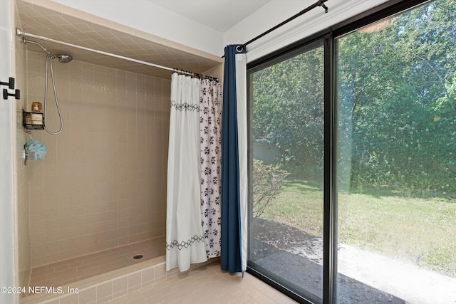 bathroom featuring tile patterned floors and curtained shower