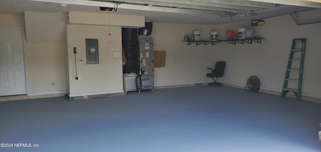 garage with a garage door opener, electric panel, and heating unit