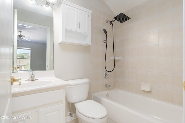 full bathroom featuring lofted ceiling, ceiling fan, toilet, vanity, and tiled shower / bath combo