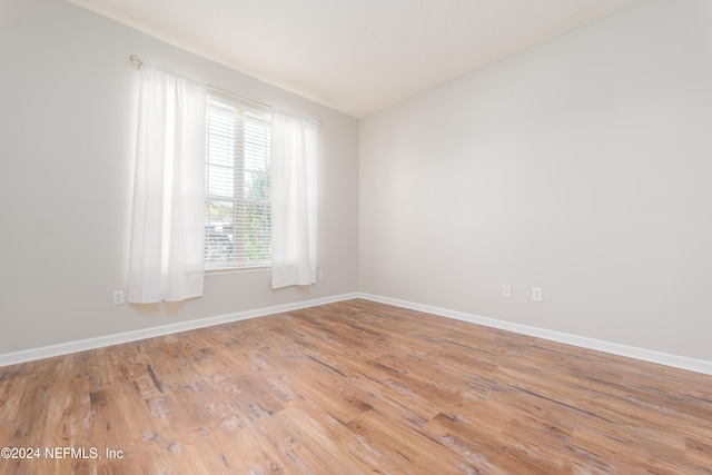 spare room with light hardwood / wood-style flooring