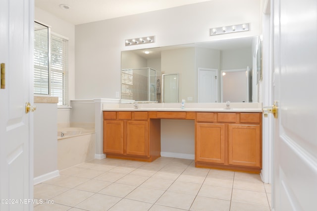 bathroom featuring vanity, independent shower and bath, and tile patterned floors