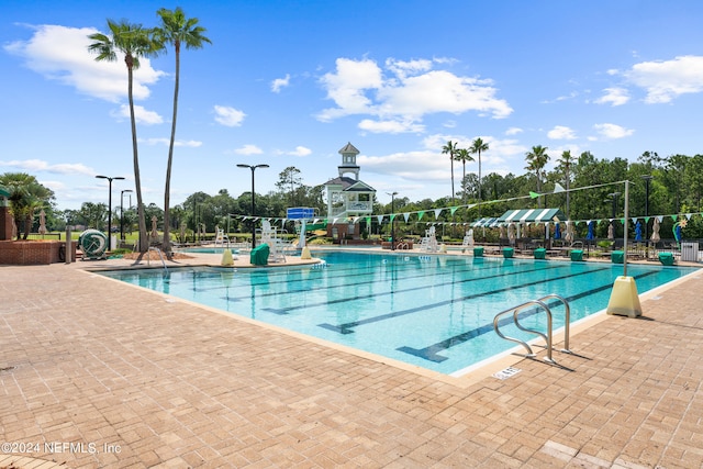 view of swimming pool with a patio area