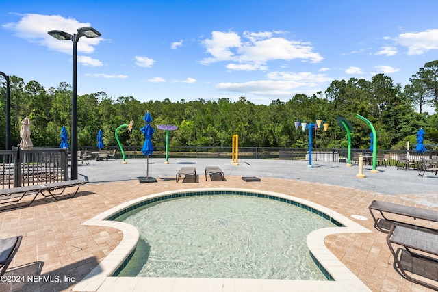 view of pool with a patio