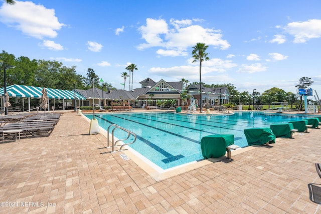 view of pool featuring a patio