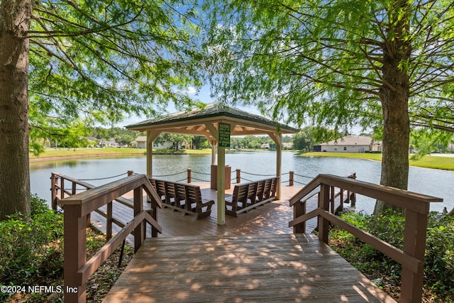 dock area with a gazebo and a water view