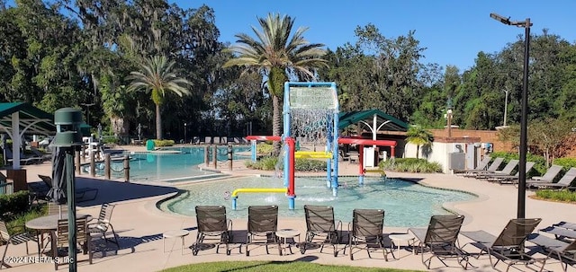 view of swimming pool featuring a patio area and pool water feature