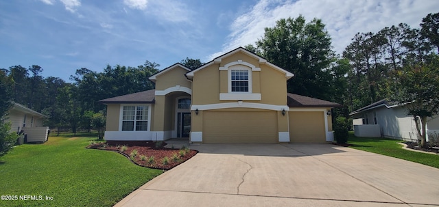 traditional-style home featuring a garage, stucco siding, fence, a front yard, and driveway