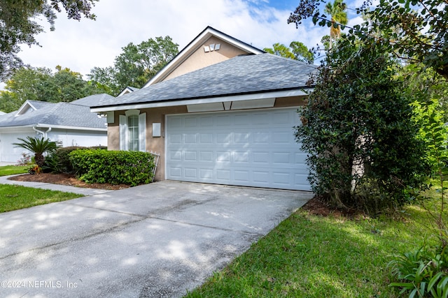 single story home featuring a garage