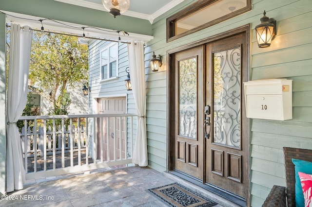 entrance to property with covered porch