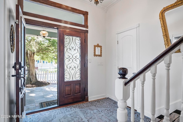 foyer entrance featuring ornamental molding