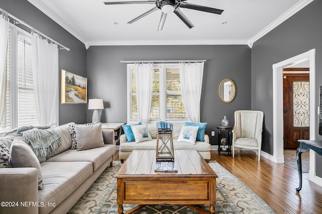 living room with ornamental molding, hardwood / wood-style flooring, and ceiling fan