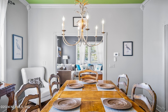 dining room featuring crown molding and a notable chandelier