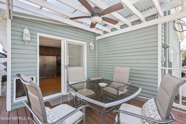 wooden terrace featuring ceiling fan