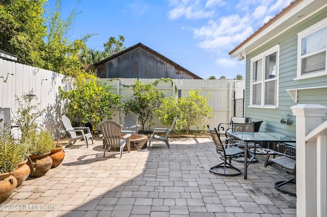 view of patio featuring an outdoor fire pit