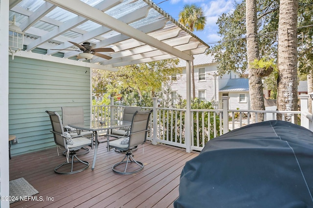 deck with ceiling fan and a pergola