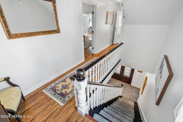 stairs with wood-type flooring