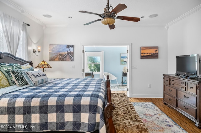 bedroom with ceiling fan, hardwood / wood-style flooring, and crown molding