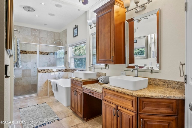 bathroom featuring vanity and shower with separate bathtub