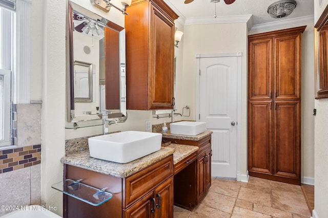 bathroom featuring backsplash, a textured ceiling, ceiling fan, vanity, and crown molding