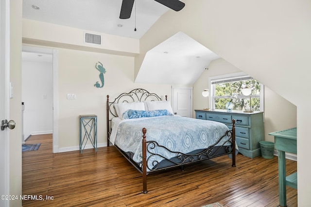 bedroom with vaulted ceiling, dark hardwood / wood-style floors, and ceiling fan