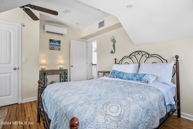 bedroom featuring ceiling fan, lofted ceiling, dark hardwood / wood-style flooring, and a wall unit AC