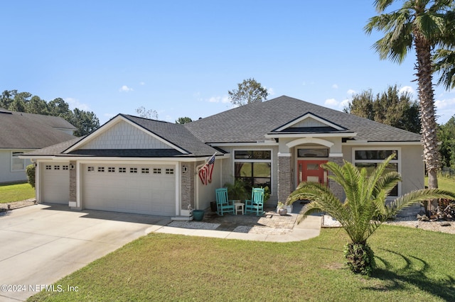 view of front facade with a front lawn and a garage