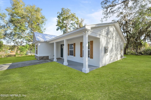 view of home's exterior with a yard