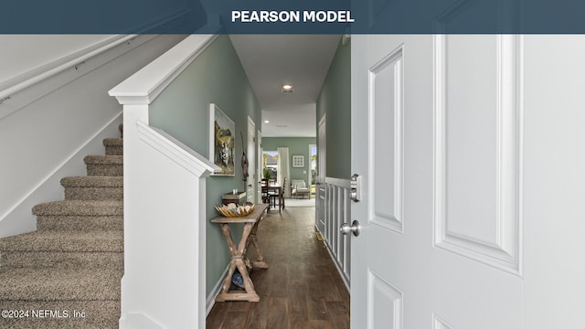 hall featuring wood finished floors, recessed lighting, and stairway