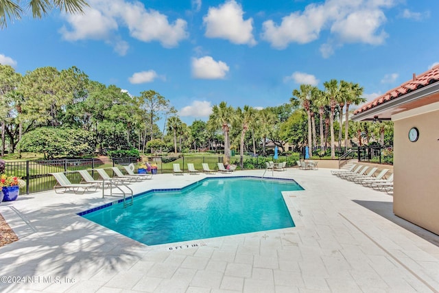 view of pool featuring a patio