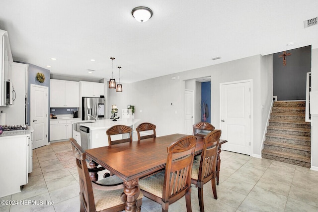 tiled dining space with sink