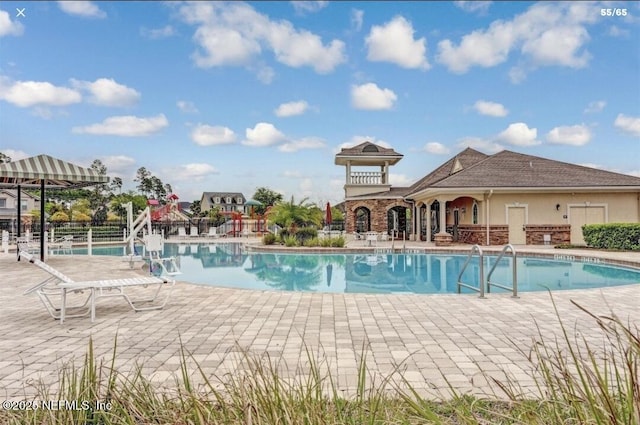 view of swimming pool with a gazebo and a patio