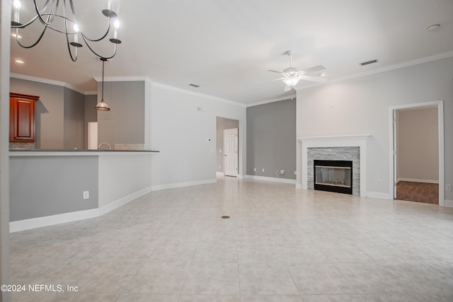 unfurnished living room with light tile patterned floors, crown molding, and ceiling fan