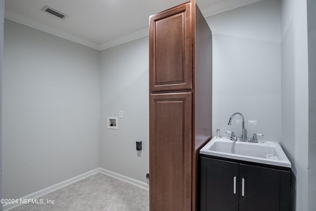 laundry area with crown molding, cabinets, hookup for a washing machine, and sink